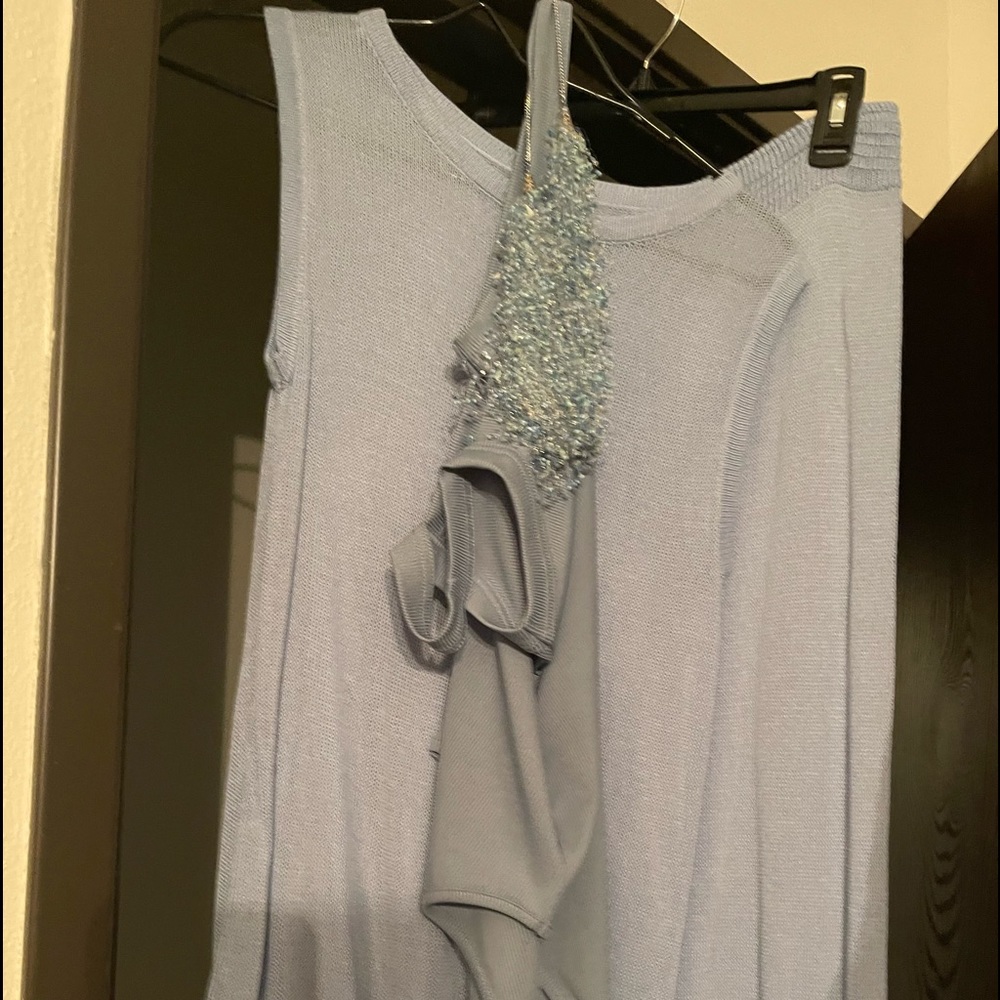Baby blue stretchy pants with a navy blue matching tank top and necklace